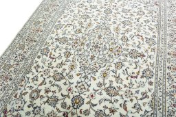 Backside of handmade New Kashan rug showing knot structure and weave density