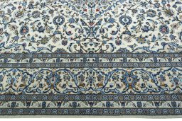 Corner detail of New Kashan rug showing border pattern and Wool pile