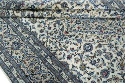 Close-up detail of New Kashan rug from Iran / Persia showing Wool weave