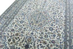 Backside of handmade New Kashan rug showing knot structure and weave density