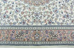 Corner detail of New Kashan rug showing border pattern and Wool pile