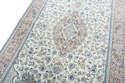 Backside of handmade New Kashan rug showing knot structure and weave density