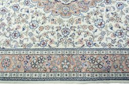 Corner detail of New Kashan rug showing border pattern and Wool pile