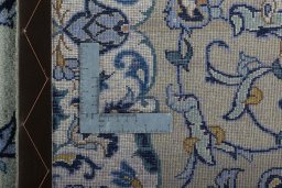 Backside of handmade 2000s Kashan rug showing knot structure and weave density