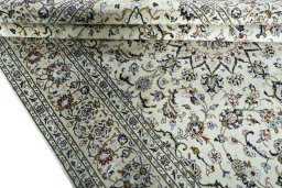 Close-up detail of 2000s Kashan rug from Iran / Persia showing Wool weave