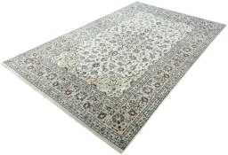 Corner detail of 2000s Kashan rug showing border pattern and Wool pile