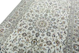 Backside of handmade 2000s Kashan rug showing knot structure and weave density