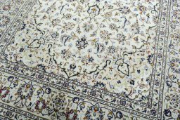 Close-up detail of 2000s Kashan rug from Iran / Persia showing Wool weave