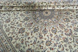 Close-up detail of 2000s Kashan rug from Iran / Persia showing Wool weave