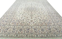 Surface texture of 2000s Kashan rug with natural Wool and intricate pattern