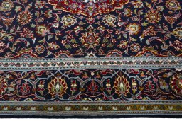 Corner detail of New Kashan rug showing border pattern and Cork pile