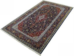 Corner detail of New Kashan rug showing border pattern and Cork pile