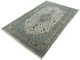 Corner detail of New Kashan rug showing border pattern and Cork pile