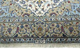 Full view of New Kashan rug from Iran / Persia, 227 × 145 cm in Beige tones