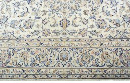 Corner detail of New Kashan rug showing border pattern and Wool pile