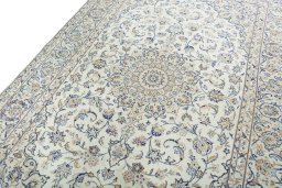 Backside of handmade New Kashan rug showing knot structure and weave density