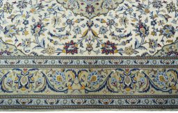 Corner detail of New Kashan rug showing border pattern and Cork pile