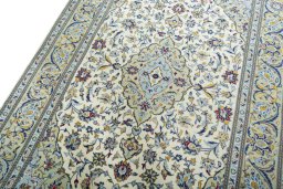 Backside of handmade New Kashan rug showing knot structure and weave density