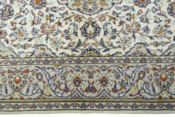 Corner detail of 1970s Kashan rug showing border pattern and Wool pile