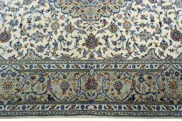 Corner detail of New Kashan rug showing border pattern and Cork pile