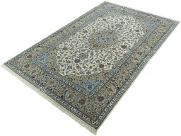 Corner detail of New Kashan rug showing border pattern and Cork pile