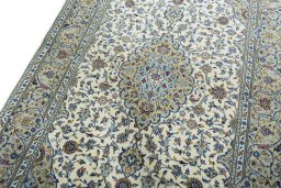 Backside of handmade New Kashan rug showing knot structure and weave density