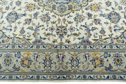 Corner detail of New Kashan rug showing border pattern and Cork pile
