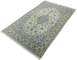 Corner detail of New Kashan rug showing border pattern and Cork pile