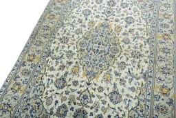 Backside of handmade New Kashan rug showing knot structure and weave density