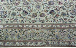 Corner detail of 1950s Kashan rug showing border pattern and Cork pile