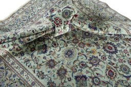 Surface texture of 1950s Kashan rug with natural Cork and intricate pattern