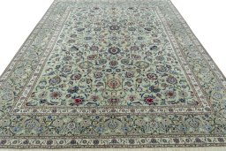 Surface texture of 1950s Kashan rug with natural Cork and intricate pattern
