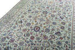 Backside of handmade 1950s Kashan rug showing knot structure and weave density