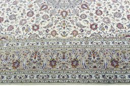 Corner detail of New Kashan rug showing border pattern and Wool pile