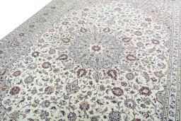 Backside of handmade New Kashan rug showing knot structure and weave density
