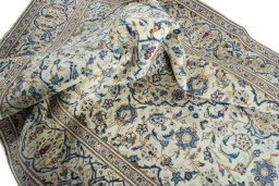 Surface texture of 2000s Kashan rug with natural Wool and intricate pattern