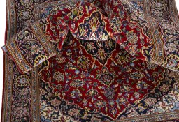 Surface texture of 2000s Kashan rug with natural Cork and intricate pattern