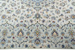 Corner detail of New Kashan rug showing border pattern and Wool pile