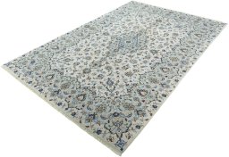 Corner detail of New Kashan rug showing border pattern and Wool pile