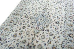 Backside of handmade New Kashan rug showing knot structure and weave density