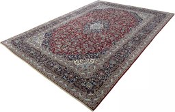 Corner detail of 2000s Kashan rug showing border pattern and Wool pile