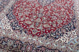 Close-up detail of 2000s Kashan rug from Iran / Persia showing Wool weave
