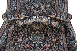 Surface texture of 2000s Kashan rug with natural Wool and intricate pattern