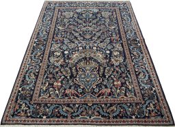 Surface texture of 2000s Kashan rug with natural Wool and intricate pattern