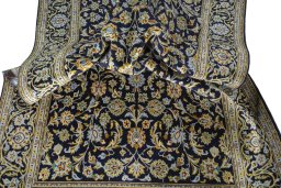 Surface texture of 1970s Kashan rug with natural Wool and intricate pattern
