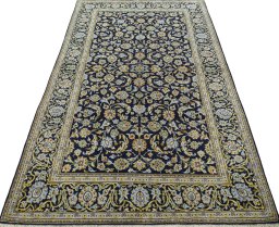 Surface texture of 1970s Kashan rug with natural Wool and intricate pattern