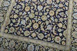 Close-up detail of 1970s Kashan rug from Iran / Persia showing Wool weave