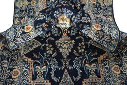 Close-up detail of 2000s Kashan rug from Iran / Persia showing Wool weave