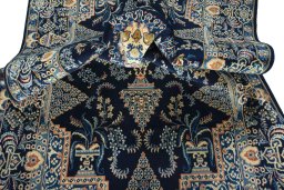 Close-up detail of 2000s Kashan rug from Iran / Persia showing Wool weave