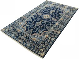 Corner detail of 2000s Kashan rug showing border pattern and Wool pile